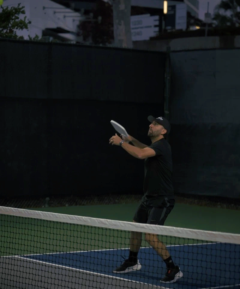 Elevated player preparing for a paddle strike