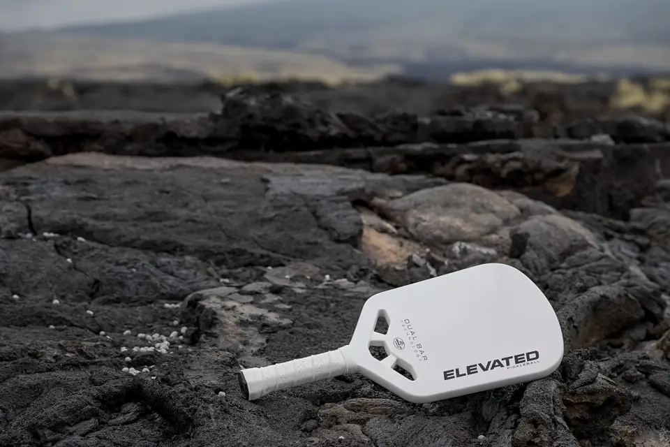 White APEX paddle on rocks — landscape